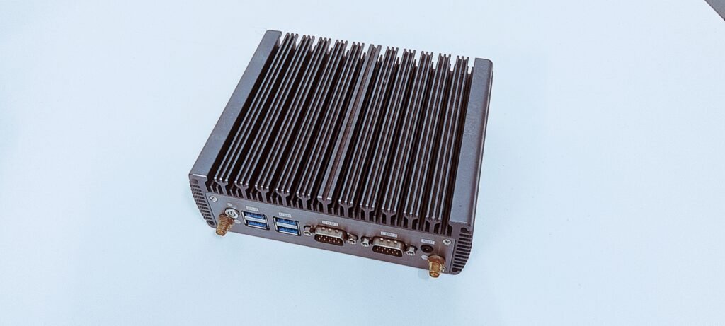 Rear I/O panel of a dual-LAN industrial mini PC with HDMI, VGA, and DC-12V input